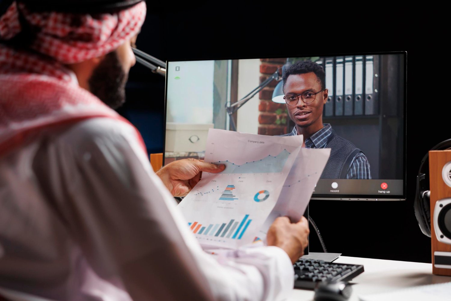 a man looking at a man on a computer screen